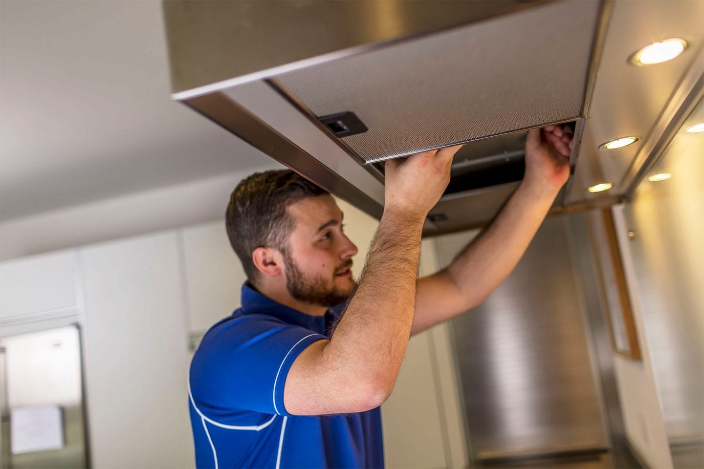 Kitchen hood installer fitting commercial canopy in Manchester